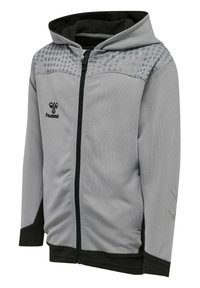 Felpa con cappuccio grigia realizzata in tessuto leggero, con dettagli neri, chiusura con zip frontale e motivo circolare nella parte superiore.