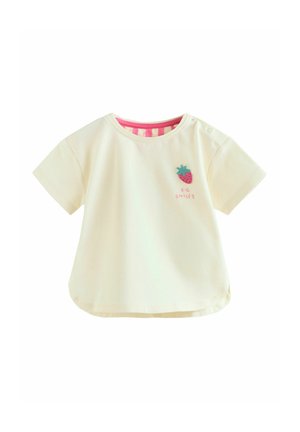 Creme kortærmet toddler-skjorte med pinkstribet hals, broderet jordbær og teksten "Big Smiles" på brystet.