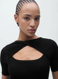Black ribbed knit top with a square neckline, short sleeves, and an intersecting design at the chest. Smooth texture, form-fitting shape.