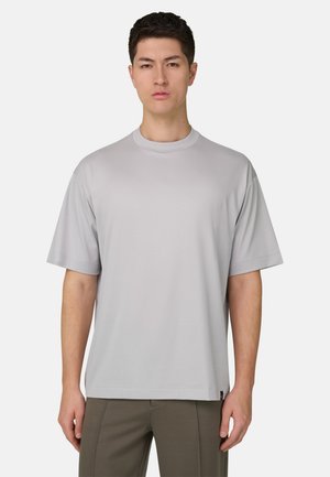 Hellgraues kurzärmeliges T-Shirt mit Rundhalsausschnitt, aus weichem Stoff gefertigt, mit lockerem Sitz und minimalistischem Design.