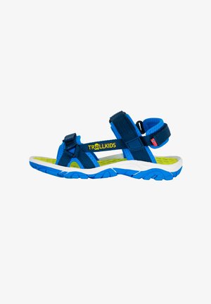 Blue sandals with adjustable straps, featuring a cushioned insole, textured outsole, and "TROLLKIDS" logo in yellow.