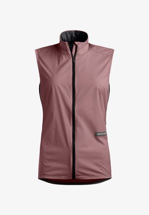 Sleeveless, dusty rose windbreaker vest with high collar and front black zipper, lightweight fabric, and small rectangular logo patch on side.