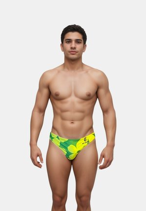Slip da bagno colorati da uomo con un motivo floreale di fiori gialli e verdi, con una texture intrecciata e una vita elastica per il massimo comfort.