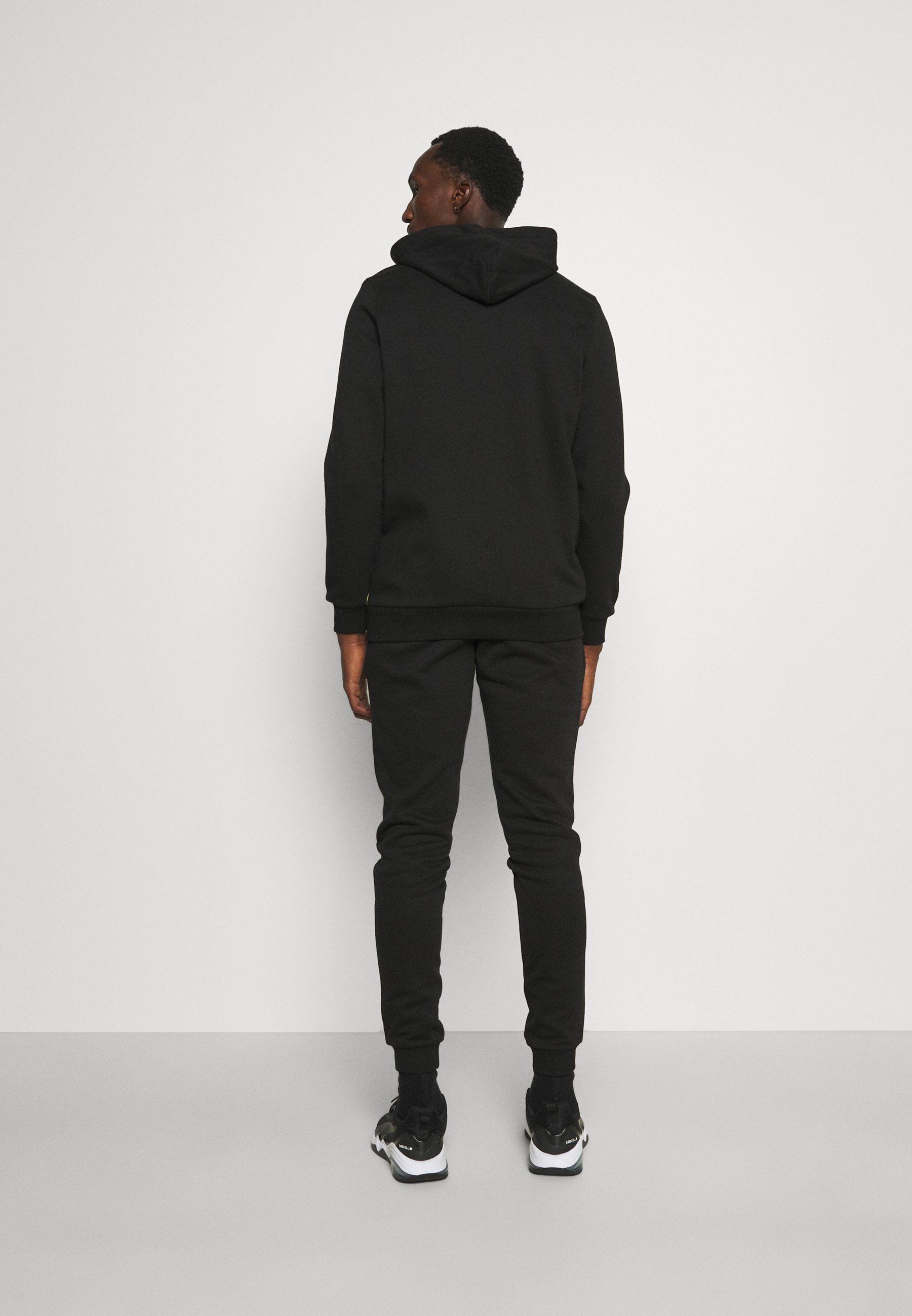 Puma COLORBLOCK SUIT - Chándal - peacoat/azul marino - Zalando.es
