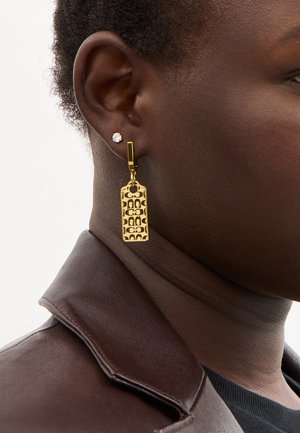 Gold pendant earrings featuring a rectangular shape with a patterned surface. Set on a gold-tone hook for secure wearing.