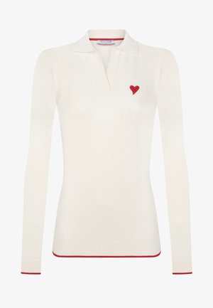 Valge pika varrukaga polo särk, mis on valmistatud pehmest kangast, vasakul rinnal on punane süda tikand ja kaelusel ning äärtel on punased aktsendid.