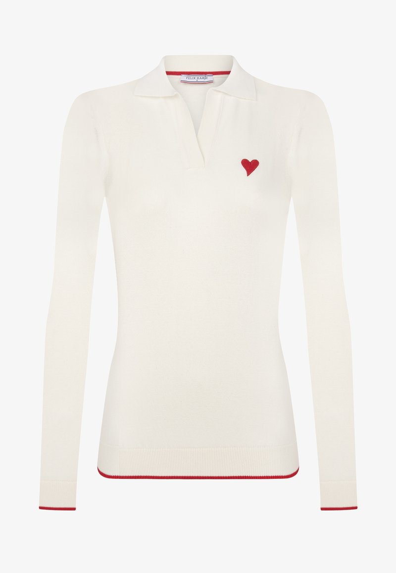 Biała, długa koszula polo z miękkiego materiału, z czerwonym haftem serca na lewej piersi oraz czerwonymi akcentami przy kołnierzyku i u dołu.
