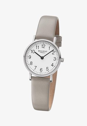 Montre-bracelet ronde en argent avec un cadran blanc, des chiffres noirs, des aiguilles des heures et des minutes noires, et un bracelet en cuir beige indiquant 10h09.