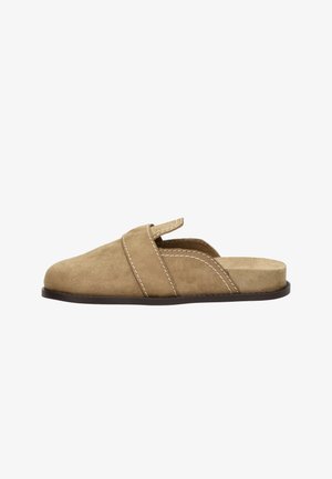 Light brown suede slip-on shoe with open back, rounded toe, and visible white stitching on upper and sole.