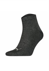 Ankle sock in dark gray ribbed fabric. Features a reinforced toe area and a subtle logo near the ankle. Soft texture and elastic cuff.