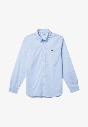 Svjetloplava dugorukava košulja na dugme od pamuka, s uspravnim ovratnikom i malim zelenim logotipom na lijevoj strani prsnog koša.