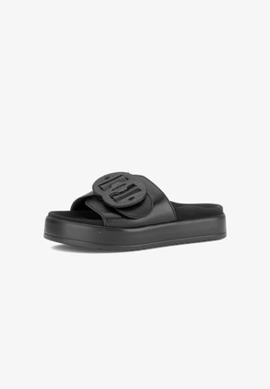 Black open-toe slide sandal with thick sole and wide strap featuring a large decorative buckle on top.