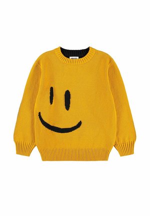 Żółty dziergany sweter z dużym czarnym uśmiechniętym wzorem z przodu oraz prążkowanymi mankietami i dółem.