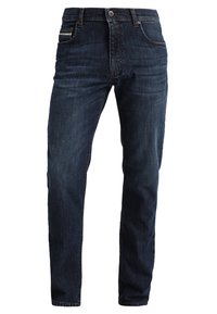Jeans de mezclilla azul oscuro con corte recto, cinco bolsillos y cremallera. La tela presenta un ligero desgaste y detalles de costura en la cinturilla.