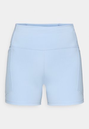 Calções atléticos azul claro feitos de um tecido elástico, com uma cintura alta e costuras flatlock. Apresentam bolsos laterais e uma textura suave.