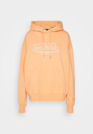Peach-colored hoodie made of soft fabric, featuring a front pocket, drawstring hood, and large white "Von Dutch Originals" logo.
