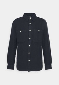 Mörkblå skjorta med knappar i strukturerad väv. Har en krage, två bröstfickor och vita knappar fram.