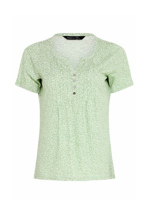 Hellgrüne Kurzarmbluse mit kleinem weißem Blumenmuster, rundem Ausschnitt mit V-Schlitz, vier Knöpfen vorne und vertikalen Falten.