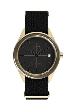 Montre automatique Timex Marlin avec un cadran noir, boîtier en acier inoxydable doré, bracelet tissé noir, marqueurs d'heure argentés et affichage de date.