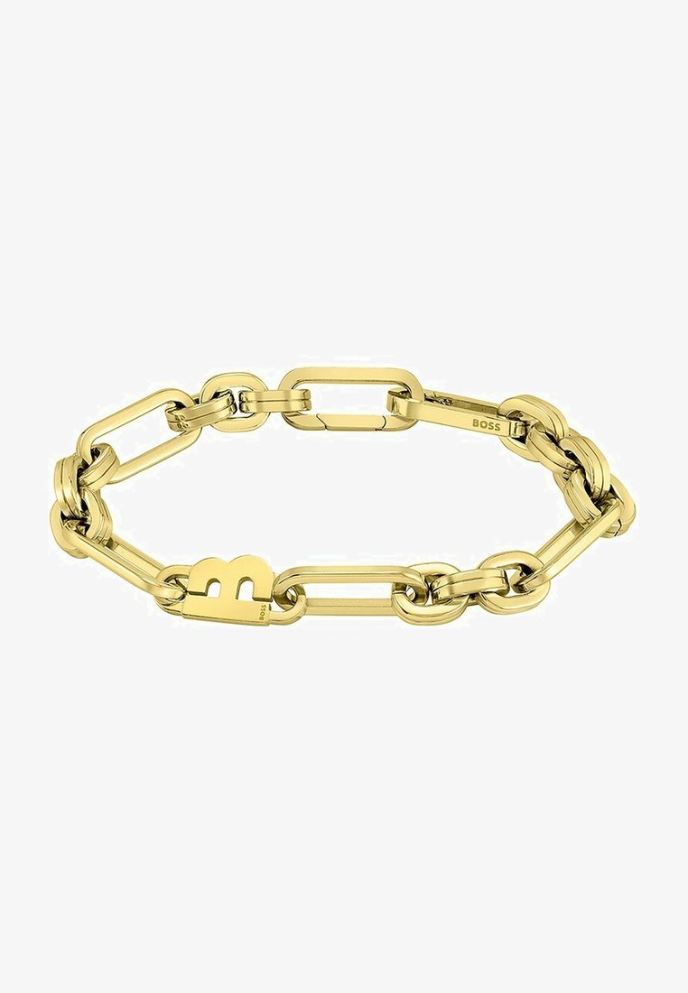 Pulsera de cadena en tono dorado con eslabones ovalados y rectangulares entrelazados, que presenta un distintivo charm con el logo 'B' en uno de los eslabones.
