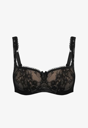 Black lace bra featuring sheer material, floral pattern, scalloped edges, adjustable straps, and a center bow detail.
