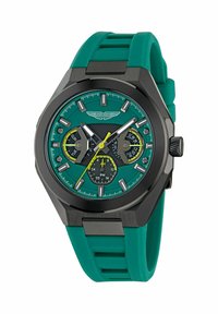 Reloj Aston Martin con una correa de goma color teal, una caja negra y una esfera brillante color teal con acentos amarillos y múltiples subesferas.