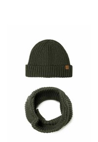 Knitted dark green beanie with ribbed texture and leather logo tag, paired with a matching dark green ribbed loop scarf.