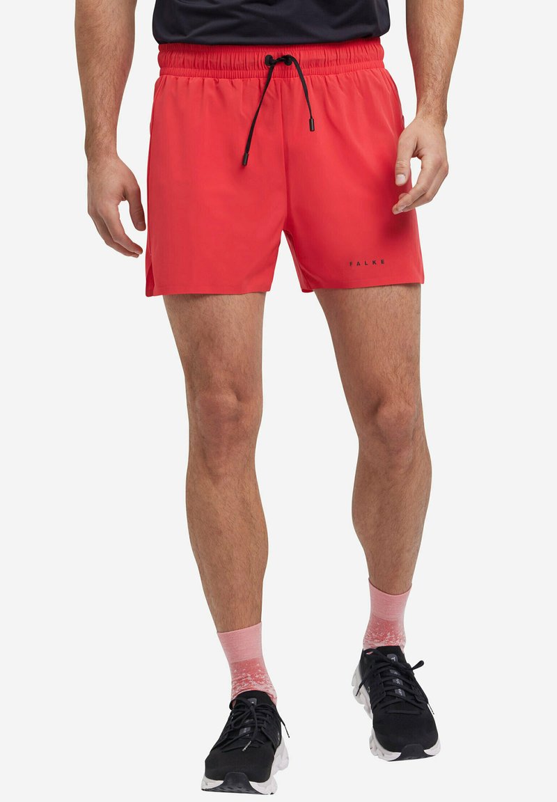 Pantaloni da bagno rossi con vita elasticizzata e cordoncino regolabile, caratterizzati da una texture liscia e un logo vicino all'orlo.