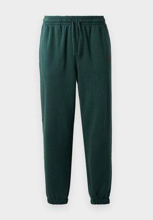 Donkergroene sweatpants met een elastische tailleband, koord en elastische boorden. Soepele textuur en een klein logopatch aan de zijkant.