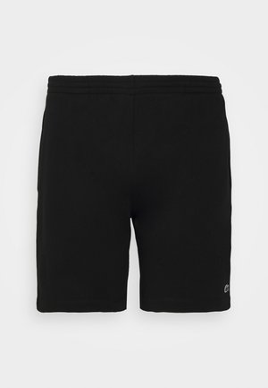 Schwarze knielange Shorts mit elastischem Bund und kleinem gesticktem Logo nahe dem Saum am rechten Bein.