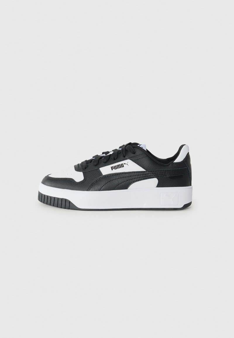 Black and white sneaker with a textured leather upper, padded collar, lace-up front, and a thick white sole with a black outsole.