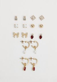 Odabrano, shiny gold-coloured