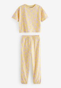 Set di pigiama giallo a fantasia con una maglietta a maniche corte con macchie viola e pantaloni lunghi abbinati con vita elasticizzata e polsini.