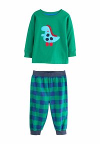 Camisa de pijama de manga larga verde con diseño de dinosaurio azul, combinada con pantalones de pijama a cuadros verdes y azules con cintura elástica.