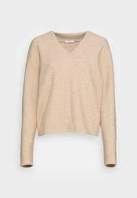 Pull beige à col en V avec manches longues, texture douce et coupe décontractée. Détail de couture remarquable sur le devant et poignets côtelés.