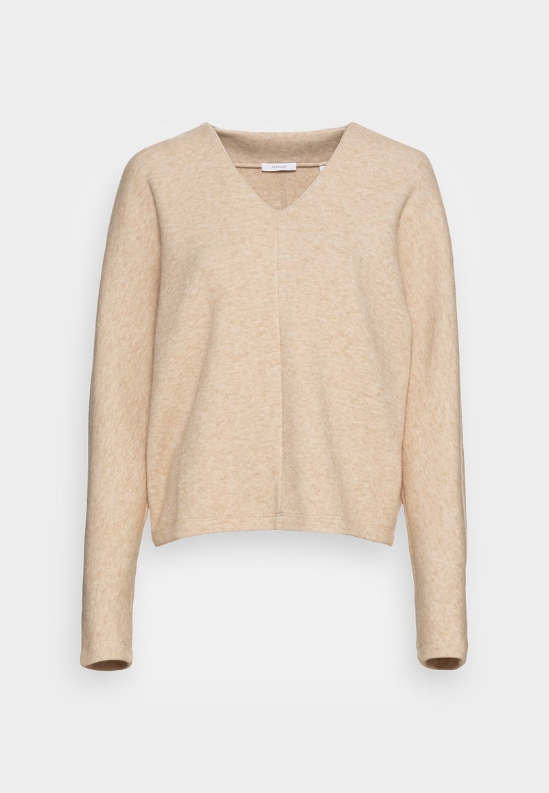 Pull beige à col en V avec manches longues, texture douce et coupe décontractée. Détail de couture remarquable sur le devant et poignets côtelés.
