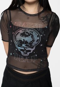 Black mesh crop top featuring a multicolored graphic of a skull and disco ball with "GRATEFUL" above and "DEAD" below, star accents.
