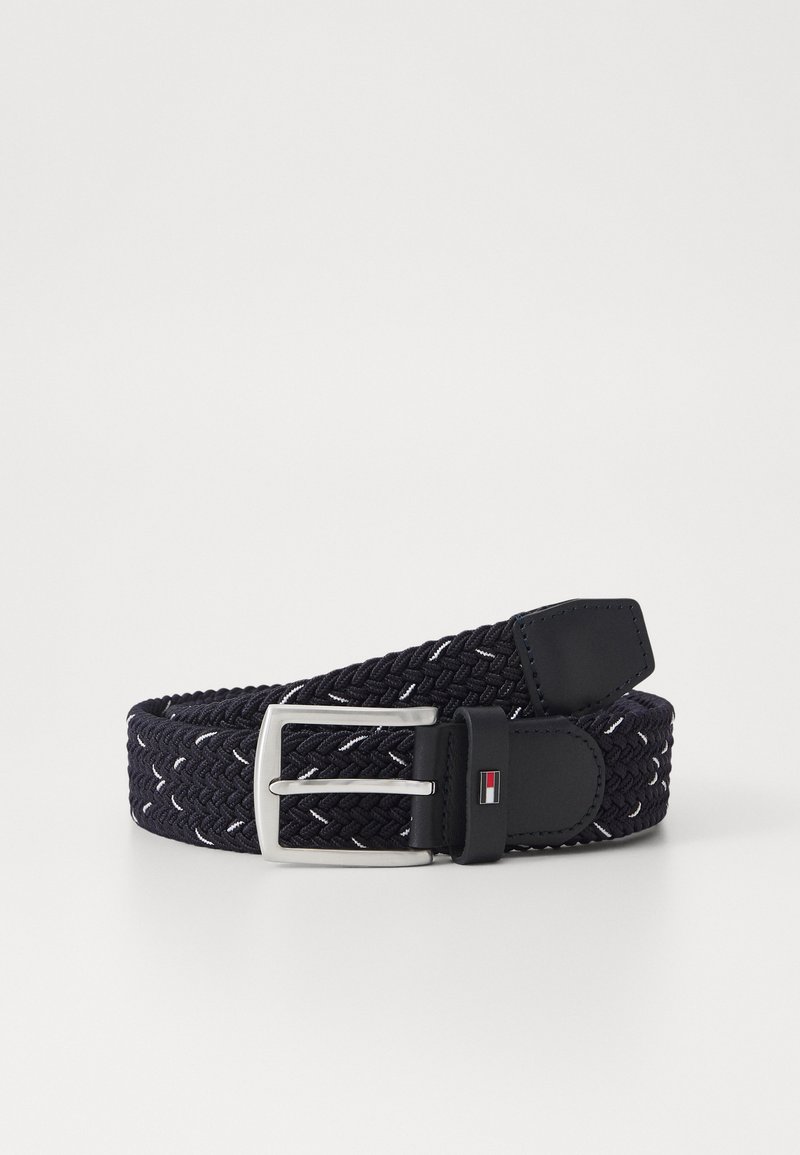 Woven navy belt with white accents, featuring a silver metal buckle and black leather trim. Flexible design for adjustable fit.