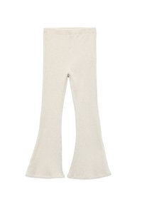 Ribbesidde flared tights i lys beige. Mykt stoff, høy midje, med en tett silhuett som klirrer ut ved kanten. Glatt tekstur uten mønstre.