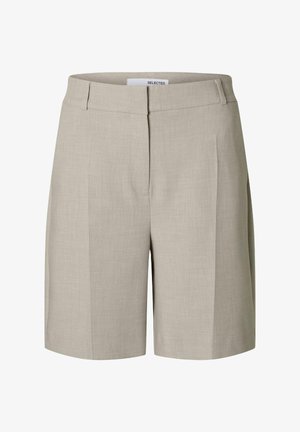 Beżowe dopasowane szorty o gładkiej fakturze, z płaskim przodem i bocznymi kieszeniami. Wykonane z lekkiego materiału dla wygody.