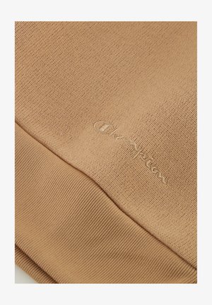 Bruine katoen trui van stof met een gestructureerde brei en geribbelde onderkant. Bevat een subtiele geborduurde "Champion" logo in bijpassend garen.