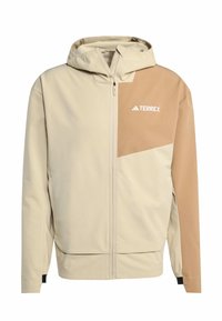 Beige en lichtbruine hoodie met rits en capuchon, voorzien van een diagonale tan kleurige patch en een witte "TERREX" logo, gemaakt van een gladde stof.