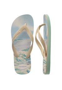 Havaianas flip-flopit ovat varustettu vaaleanbeigeillä sorminauhoilla, sinisellä teksturoidulla pohjalla, jossa on aaltoilu, ja mintunvihreällä pohjalla.