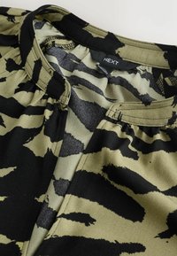 Unselected, khaki green animal print