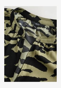 Unselected, khaki green animal print