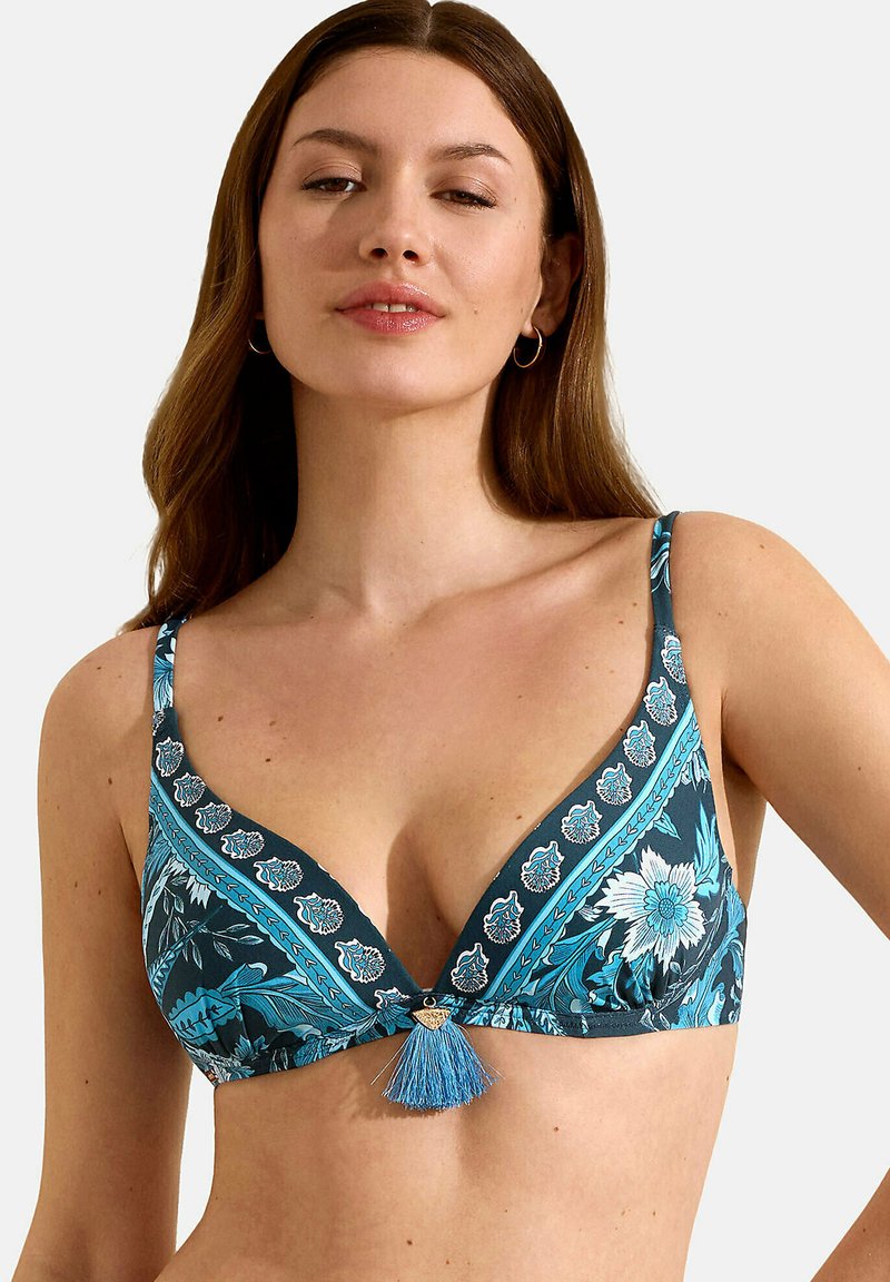 Triangel bikinitop met blauwe bloemen- en paisleypatronen, verstelbare banden en een decoratieve kwastdetail aan de voorkant.