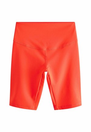 Röda sportshorts i elastiskt material, med en figurnära design, bred midja och slät yta.