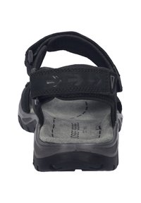 Černé sandály s nastavitelnými popruhy, polstrovanou stélkou a texturovanou gumovou podrážkou. Design je funkční s šipkovými akcenty na popruzích.