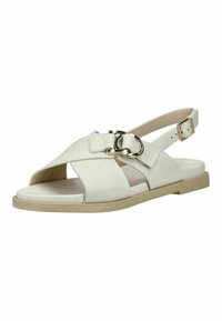 Bijela kožna sandala otvorenih prstiju s ukriženim trakama, zlatnom kopčom i detaljem prstena, te podesivom stražnjom trakom na bež ravnom potplatu.