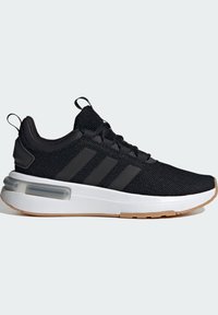 Black athletic shoe made of mesh material with a white midsole and gum rubber outsole. Features three black stripes on the side and pull tab.
